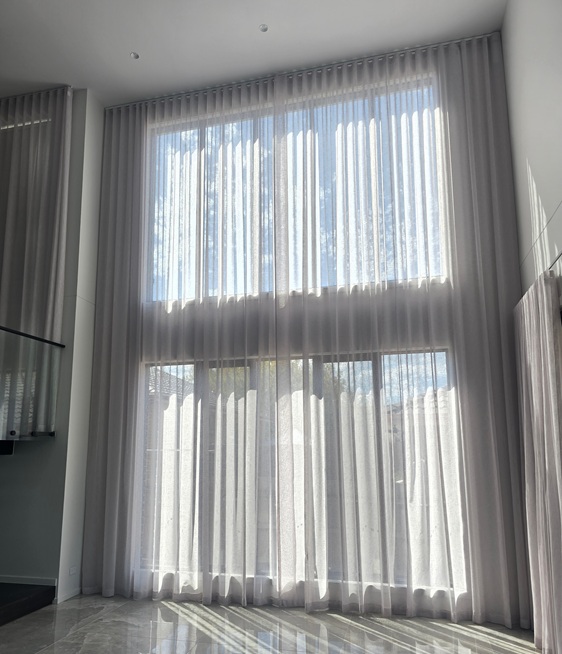 Void window dressed in wavefold sheer