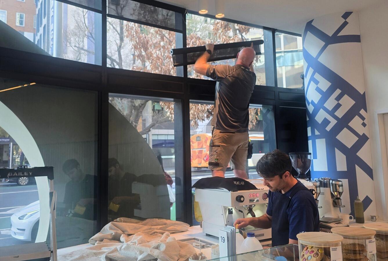 Installing battery operated screen roller blinds in a Parkville café