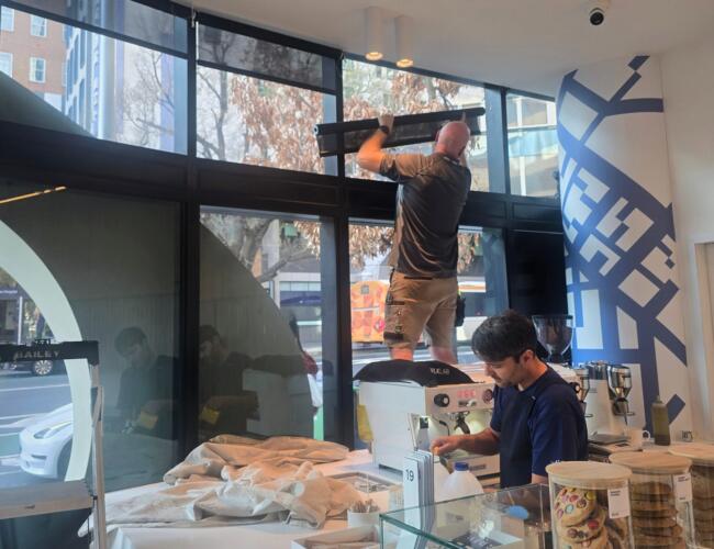 Installing battery operated screen roller blinds in a Parkville café
