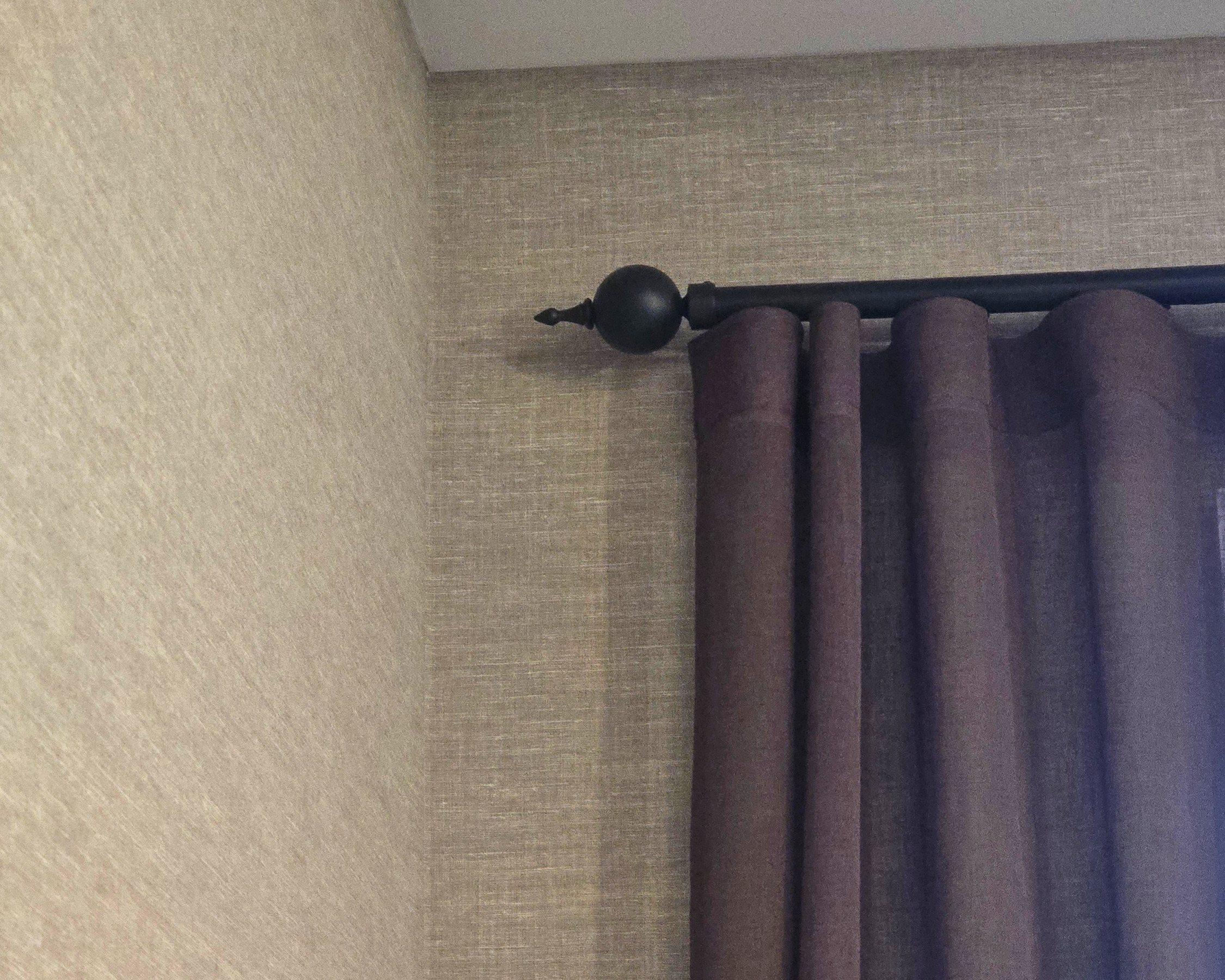 Finial on the end of a black decorator's rod
