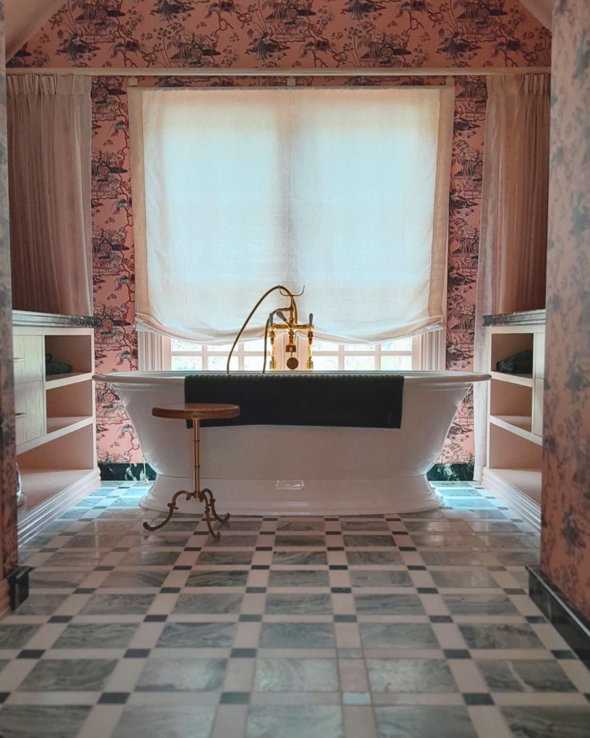A relaxed Roman blind in linen makes the perfect backdrop to this incredible ensuite
